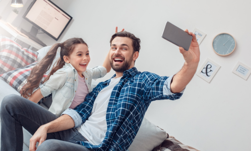 Man and girl taking a selfie